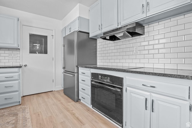 2858 S 50 W, Bountiful, UT 84010 - kitchen with black appliances, under cabinet range hood, decorative backsplash, light wood finished floors, and white cabinets