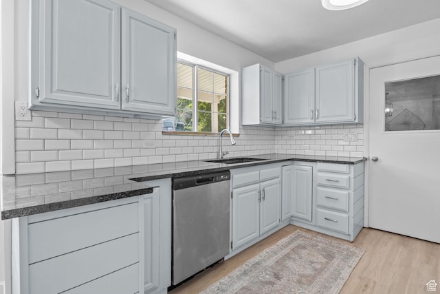 2858 S 50 W, Bountiful, UT 84010 - kitchen with dishwasher, a sink, light wood-type flooring, decorative backsplash, and dark stone countertops