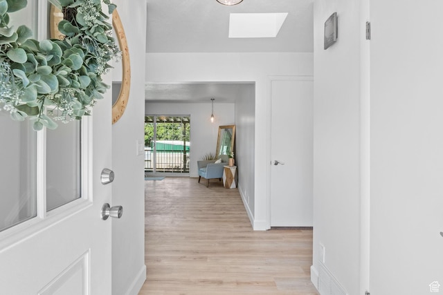 2858 S 50 W, Bountiful, UT 84010 - entrance foyer with a skylight, light wood-type flooring, and baseboards