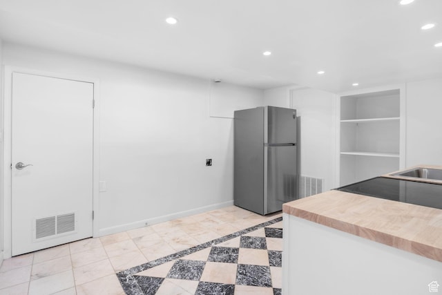 2858 S 50 W, Bountiful, UT 84010 - kitchen with freestanding refrigerator, recessed lighting, butcher block countertops, range with electric cooktop, and built in features