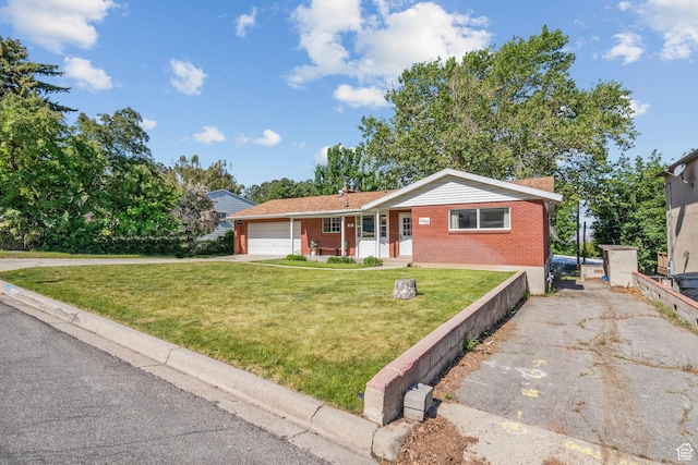 2858 S 50 W, Bountiful, UT 84010 - view of front of property with driveway, brick siding, a front lawn, and an attached garage