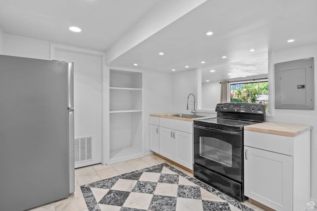 2858 S 50 W, Bountiful, UT 84010 - kitchen with freestanding refrigerator, black range with electric stovetop, electric panel, a sink, and recessed lighting