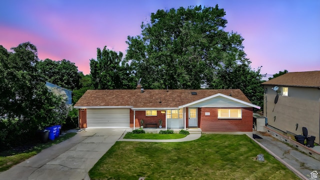 2858 S 50 W, Bountiful, UT 84010 - ranch-style home with brick siding, an attached garage, a front yard, and driveway