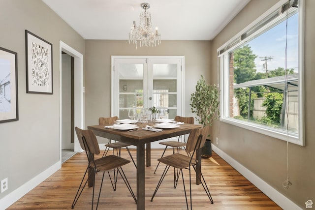 2937 S 900 E, Salt Lake City, UT 84106 - dining room with a chandelier, baseboards, and light wood-style floors