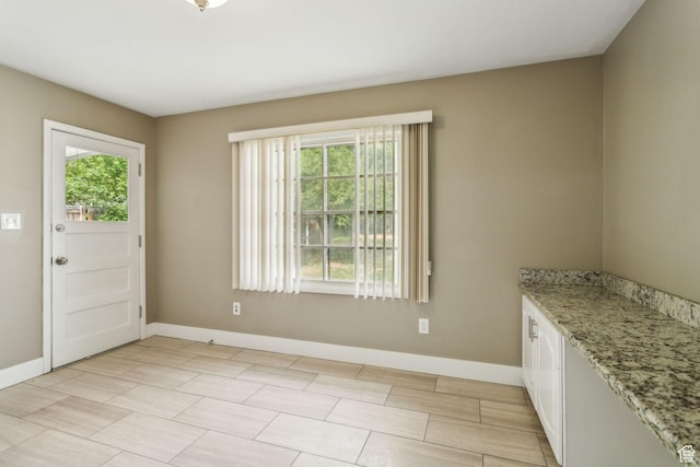 2937 S 900 E, Salt Lake City, UT 84106 - unfurnished dining area featuring baseboards