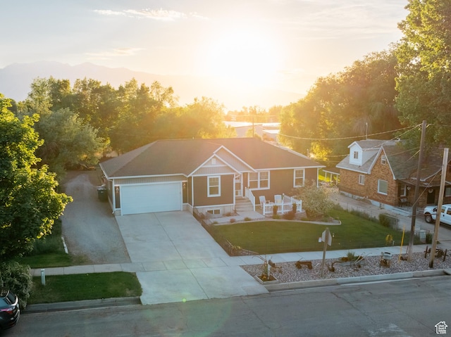 45 N Center St, Hyrum, UT 84319 - view of front of property featuring a front yard, an attached garage, and concrete driveway