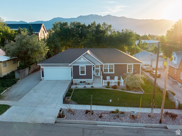 45 N Center St, Hyrum, UT 84319 - view of front of home featuring concrete driveway, a garage, and a mountain view