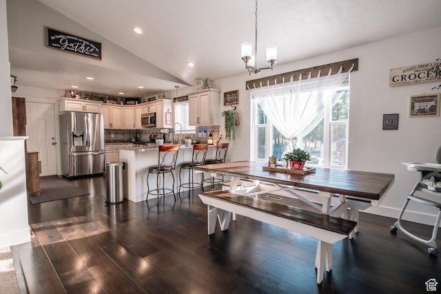 45 N Center St, Hyrum, UT 84319 - dining space with lofted ceiling, dark wood-style flooring, recessed lighting, and a chandelier