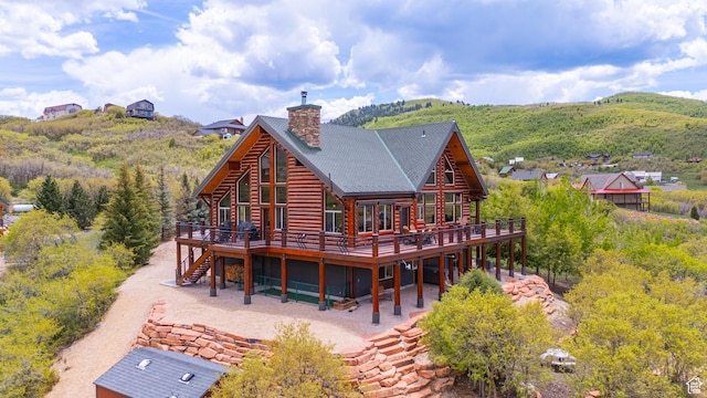 1551 Tree Top Ln Unit 360, Heber City, UT 84032 - rear view of property featuring a deck, log exterior, a chimney, and stairs