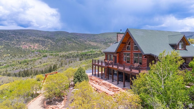 1551 Tree Top Ln Unit 360, Heber City, UT 84032 - back of property with a deck with mountain view and a chimney