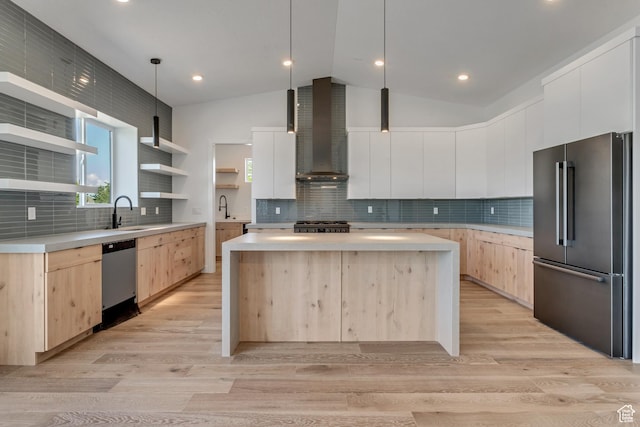 713 E 1450 N, Orem, UT 84097 - kitchen with stainless steel appliances, light brown cabinets, wall chimney exhaust hood, modern cabinets, and vaulted ceiling