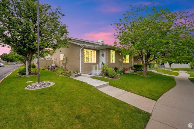 1502 W Cornerstone Dr, South Jordan, UT 84095 - view of front of home featuring brick siding and a chimney