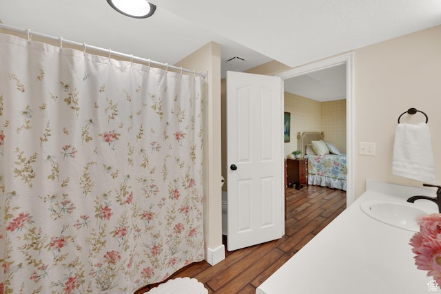 1502 W Cornerstone Dr, South Jordan, UT 84095 - ensuite bathroom with wood finished floors, vanity, and curtained shower
