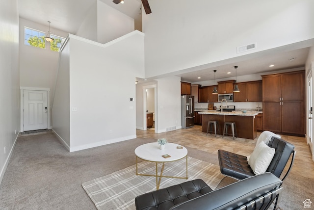 4269 S Haven Park Way, Holladay, UT 84124 - living room with a towering ceiling, baseboards, recessed lighting, a ceiling fan, and light carpet