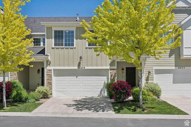 4269 S Haven Park Way, Holladay, UT 84124 - view of front of property featuring board and batten siding, stone siding, concrete driveway, and an attached garage