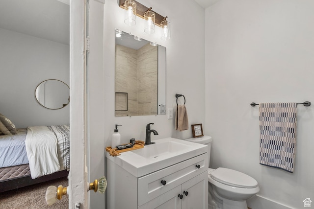 2955 S Jefferson Ave E, Ogden, UT 84403 - bathroom featuring vanity, toilet, connected bathroom, and baseboards