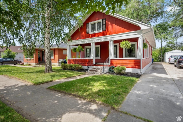 2955 S Jefferson Ave E, Ogden, UT 84403 - view of front of house featuring covered porch and a front lawn