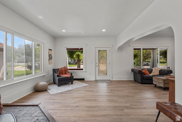 2955 S Jefferson Ave E, Ogden, UT 84403 - living area featuring light wood-style flooring, arched walkways, recessed lighting, and baseboards