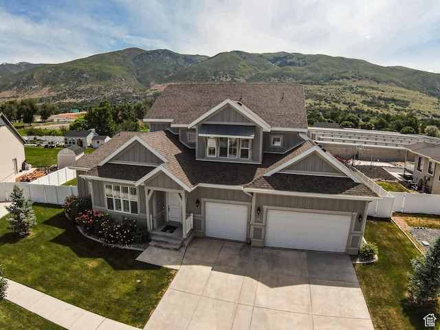 1065 S 425 W, Farmington, UT 84025 - view of front of home with board and batten siding, a shingled roof, a mountain view, driveway, and a garage