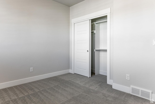 1065 S 425 W, Farmington, UT 84025 - unfurnished bedroom with dark carpet, baseboards, and a closet