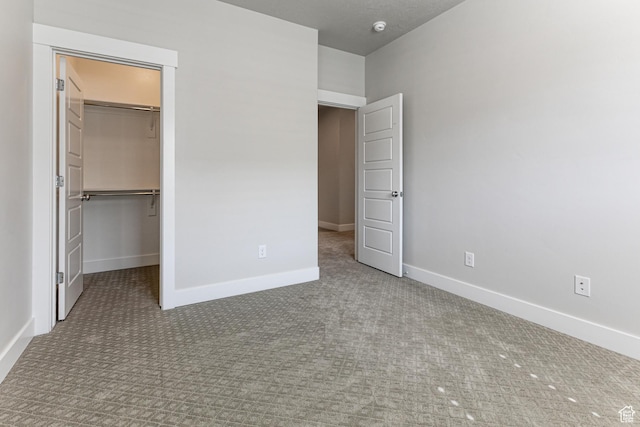 1065 S 425 W, Farmington, UT 84025 - unfurnished bedroom featuring carpet floors, a spacious closet, baseboards, and a closet