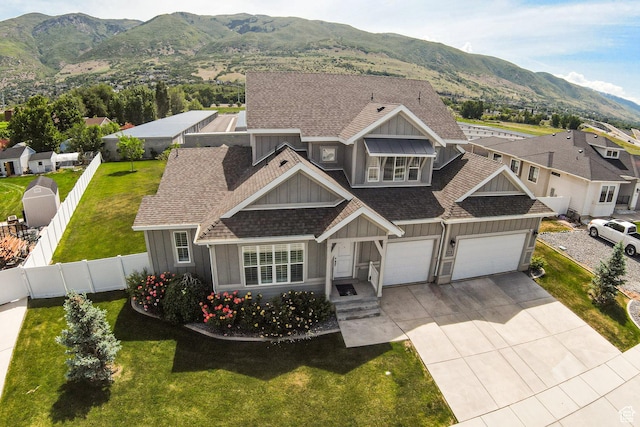 1065 S 425 W, Farmington, UT 84025 - view of front of property featuring board and batten siding, driveway, a mountain view, and roof with shingles