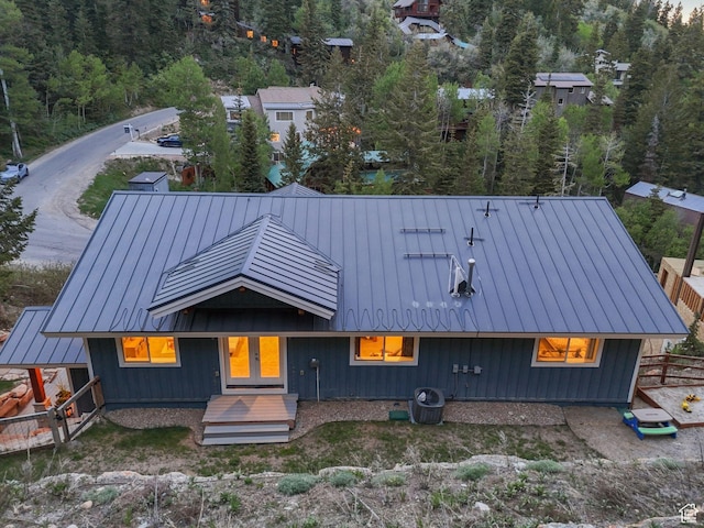 705 Parkview Dr, Summit Park, UT 84098 - rear view of house with a standing seam roof, metal roof, and a view of trees