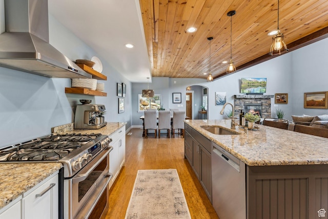 705 Parkview Dr, Summit Park, UT 84098 - kitchen featuring appliances with stainless steel finishes, extractor fan, a sink, arched walkways, and wood ceiling