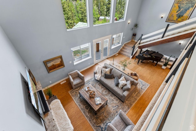 705 Parkview Dr, Summit Park, UT 84098 - living room featuring wood finished floors, baseboards, and a high ceiling