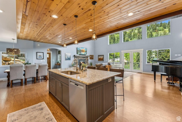 705 Parkview Dr, Summit Park, UT 84098 - kitchen featuring a sink, dishwasher, arched walkways, open floor plan, and wood ceiling
