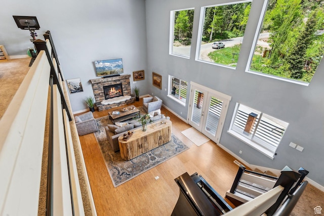 705 Parkview Dr, Summit Park, UT 84098 - living room with a stone fireplace, baseboards, and a high ceiling