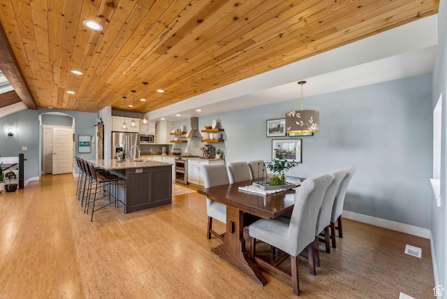 705 Parkview Dr, Summit Park, UT 84098 - dining space with arched walkways, baseboards, recessed lighting, light wood-style flooring, and wood ceiling