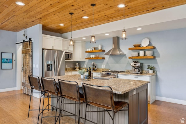 705 Parkview Dr, Summit Park, UT 84098 - kitchen with stainless steel appliances, wall chimney range hood, open shelves, recessed lighting, and baseboards