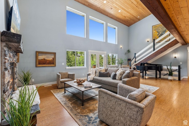 705 Parkview Dr, Summit Park, UT 84098 - living area featuring wooden ceiling with exposed beams, stairway, wood finished floors, a high ceiling, and baseboards