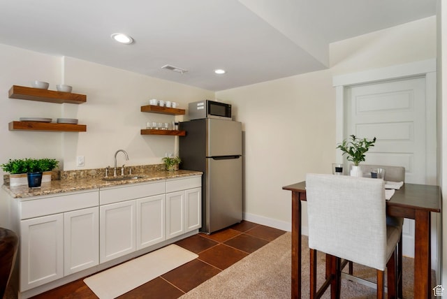 705 Parkview Dr, Summit Park, UT 84098 - kitchen with a sink, freestanding refrigerator, open shelves, light stone counters, and recessed lighting