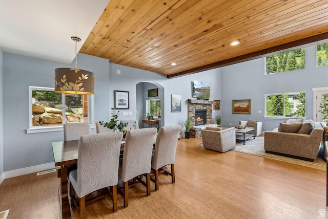 705 Parkview Dr, Summit Park, UT 84098 - dining room featuring arched walkways, a fireplace, light wood finished floors, wooden ceiling, and recessed lighting