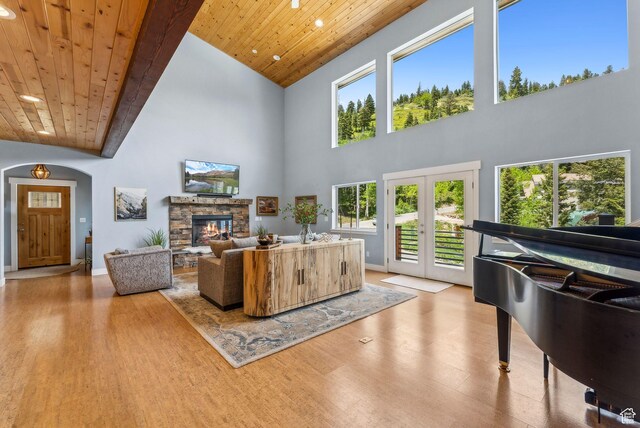 705 Parkview Dr, Summit Park, UT 84098 - living room featuring wood finished floors, wood ceiling, recessed lighting, high vaulted ceiling, and a stone fireplace