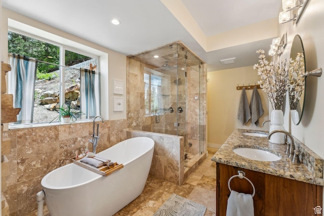 705 Parkview Dr, Summit Park, UT 84098 - bathroom featuring a shower stall, tile walls, a soaking tub, double vanity, and recessed lighting