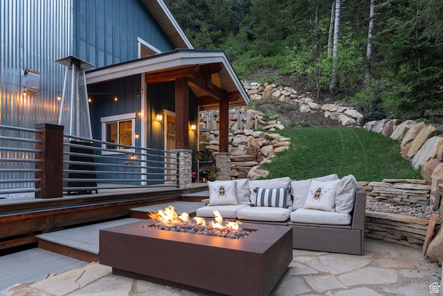 705 Parkview Dr, Summit Park, UT 84098 - view of patio featuring an outdoor living space with a fire pit and a view of trees