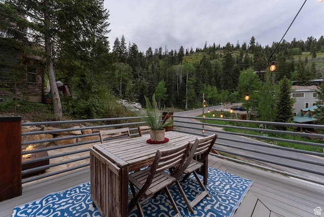 705 Parkview Dr, Summit Park, UT 84098 - wooden terrace with a wooded view and outdoor dining area