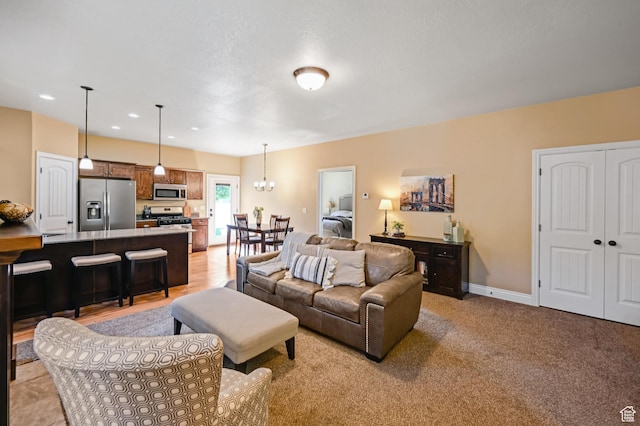 658 S 150 E, Smithfield, UT 84335 - living area with a chandelier, baseboards, and recessed lighting