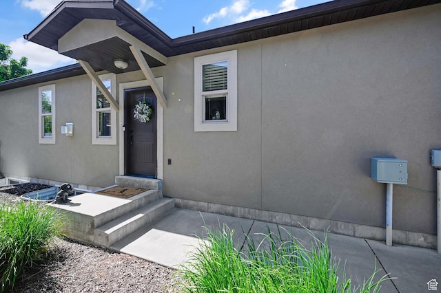 658 S 150 E, Smithfield, UT 84335 - doorway to property featuring stucco siding