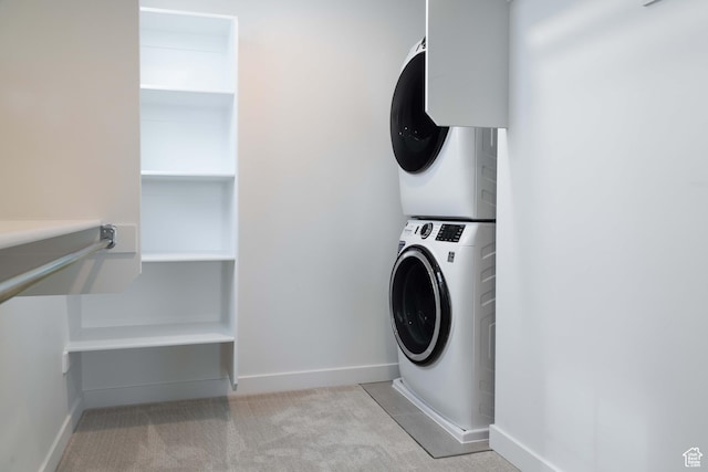 7017 W S Jordan Pkwy, South Jordan, UT 84009 - laundry room featuring estacked washer and dryer, light carpet, and baseboards