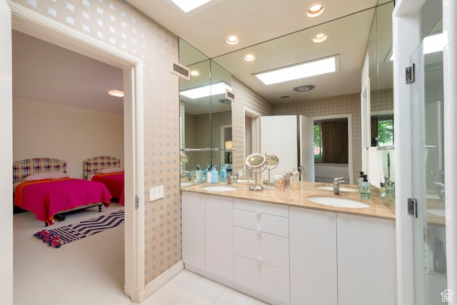 2285 E Cottonwood Cir, Holladay, UT 84117 - ensuite bathroom with wallpapered walls, double vanity, tile patterned floors, and recessed lighting