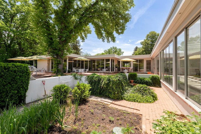 2285 E Cottonwood Cir, Holladay, UT 84117 - view of yard featuring a patio and a sunroom