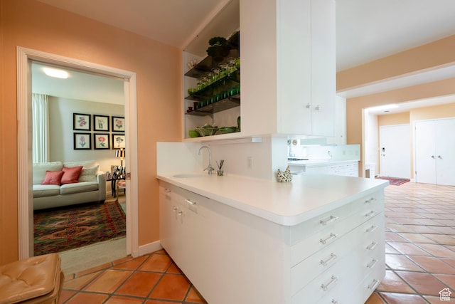 2285 E Cottonwood Cir, Holladay, UT 84117 - kitchen with a sink, open shelves, light tile patterned floors, and light countertops