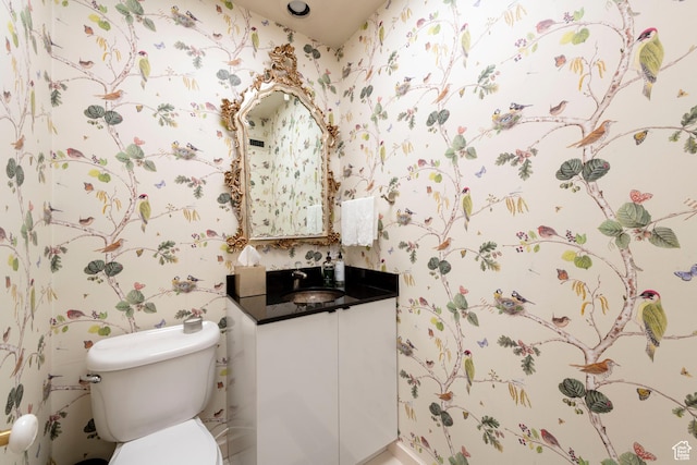 2285 E Cottonwood Cir, Holladay, UT 84117 - bathroom with wallpapered walls, vanity, and toilet