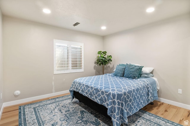 1295 E Granite Peak Rd, Eagle Mountain, UT 84005 - bedroom featuring baseboards, wood finished floors, and recessed lighting