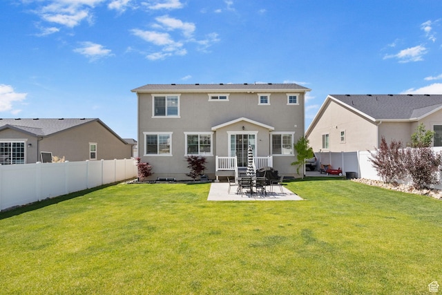 1295 E Granite Peak Rd, Eagle Mountain, UT 84005 - back of property with stucco siding and a patio area