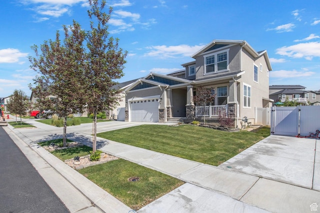 1295 E Granite Peak Rd, Eagle Mountain, UT 84005 - view of front facade featuring a gate, covered porch, concrete driveway, stucco siding, and an attached garage